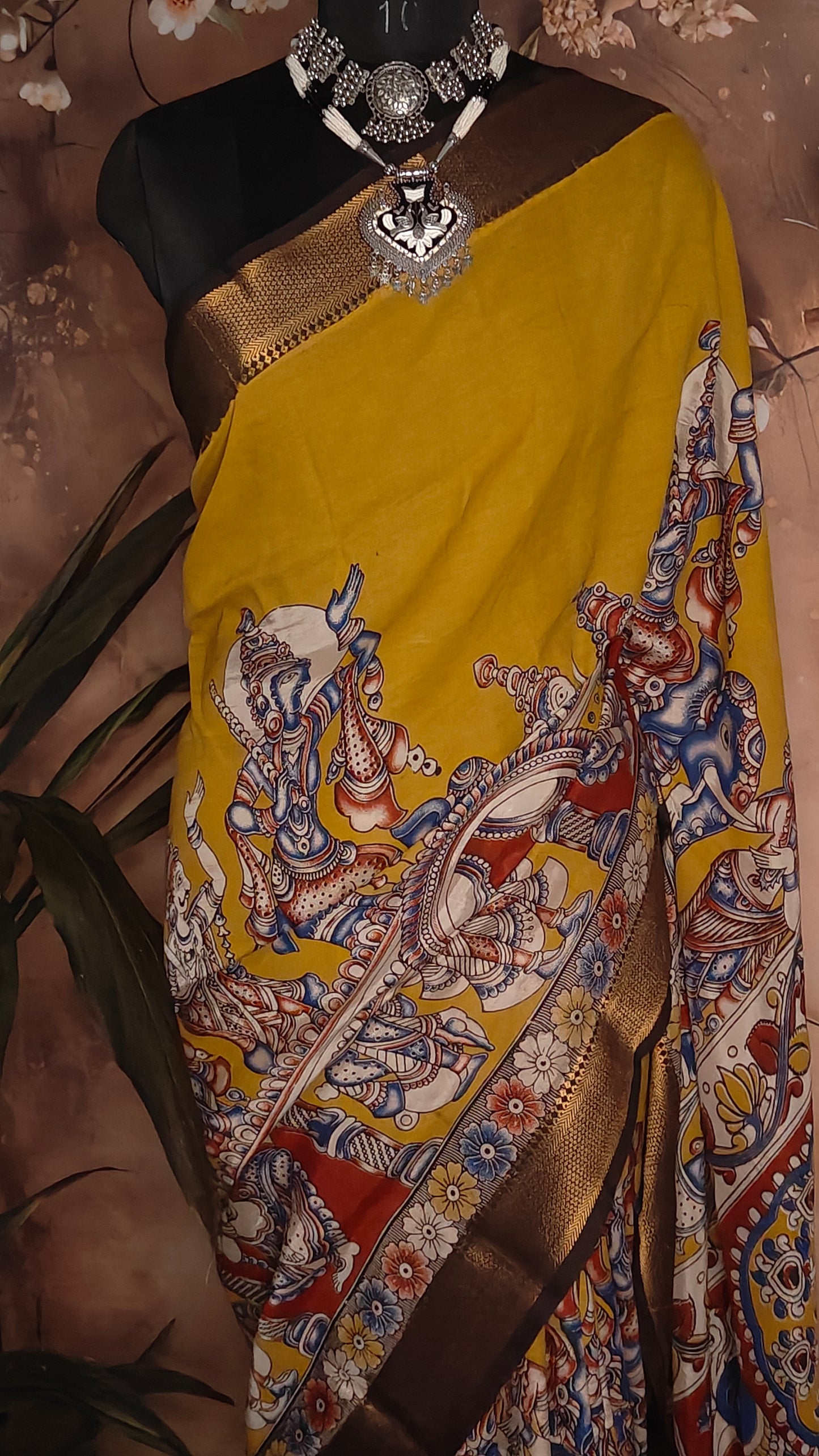 Handcrafted Mangalgiri Border Silk Saree with Temple Art Motifs-Yellow color saree with intricate patterns on a mannequin against a neutral background.
