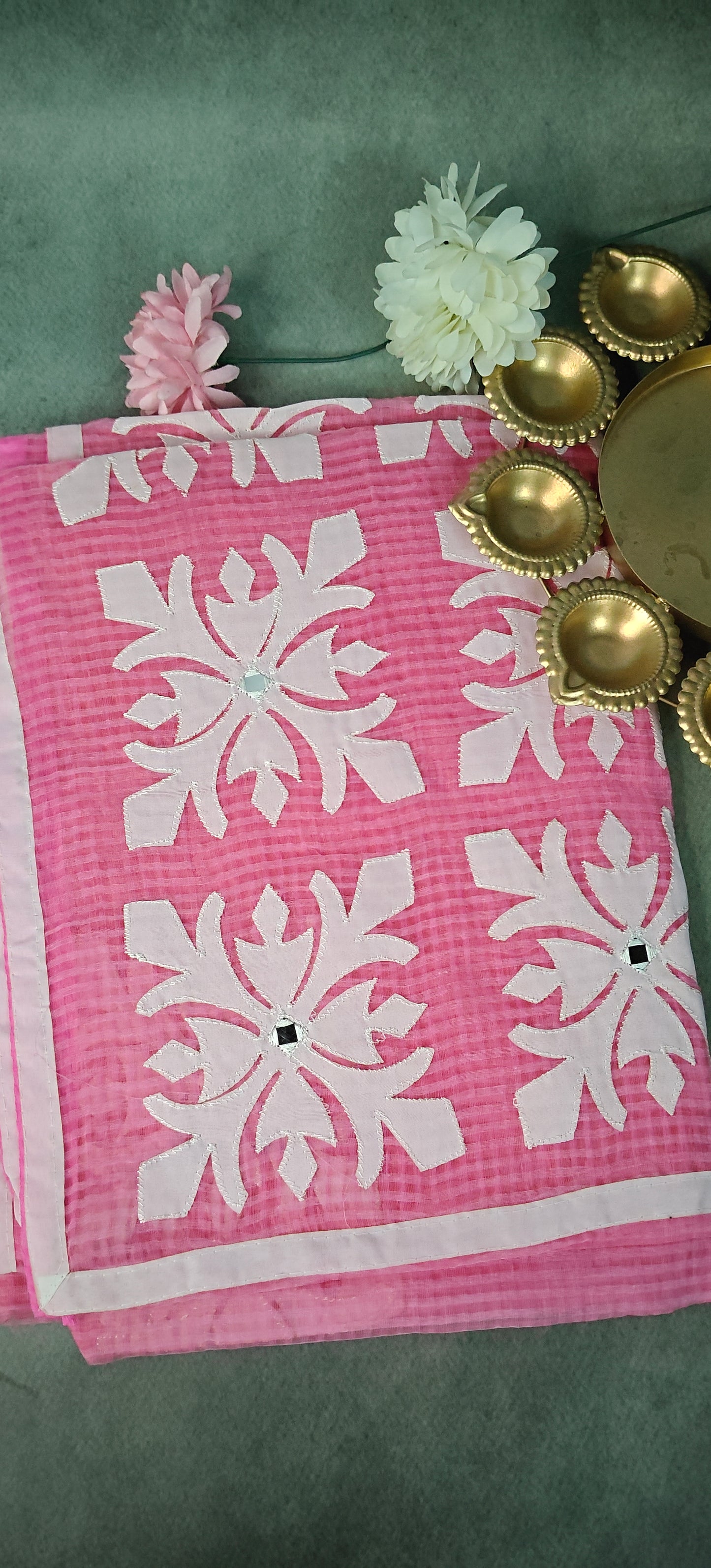 Pink Kota saree with symmetrical white floral appliqué and soft texture, handcrafted traditional Indian saree.