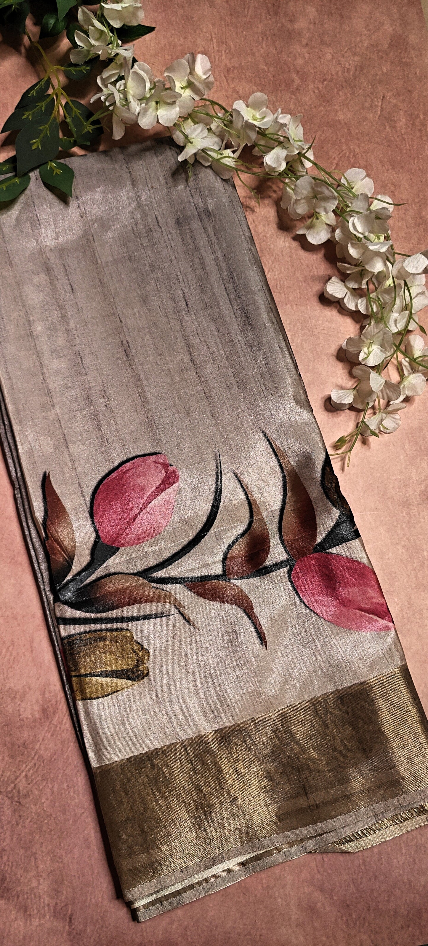 Grey viscose silk saree with soft floral design, lightweight traditional Indian attire for elegant occasions.