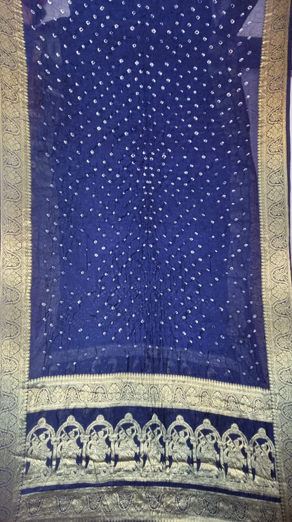An Art Silk Bandhani with Golden Zari - Royal Blue, featuring small scattered motifs in the center and a decorative band of arch motifs near the bottom.