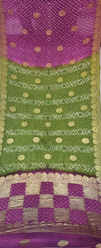 A folded and draped Art Silk saree with Bandhani - Green & Magenta
