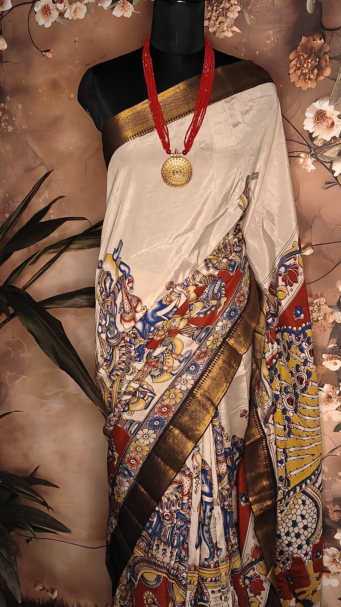 Handcrafted Mangalgiri Border Silk Saree with Temple Art Motifs-Cream color saree with intricate patterns on a mannequin against a neutral background.