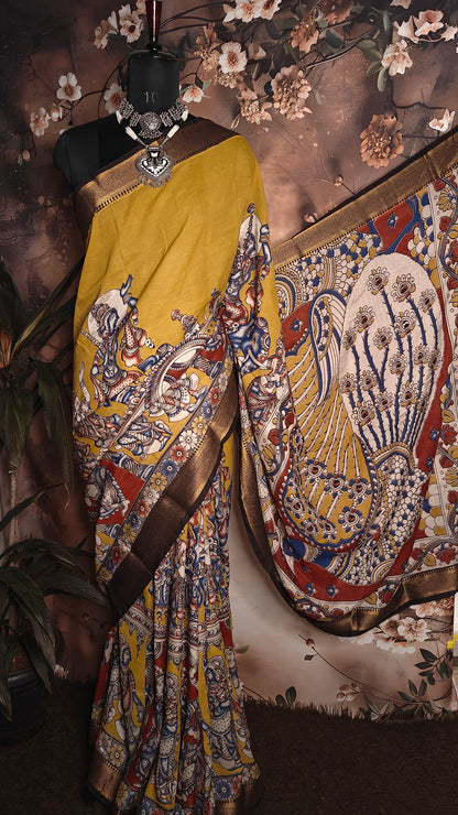 Handcrafted Mangalgiri Border Silk Saree with Temple Art Motifs-Yellow color saree with intricate patterns on a mannequin against a neutral background.