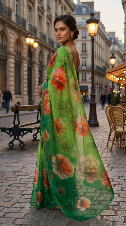 An over-the-shoulder look of a model walking down a historic city boulevard, showcasing the fluid drape of an emerald green floral printed chiffon saree