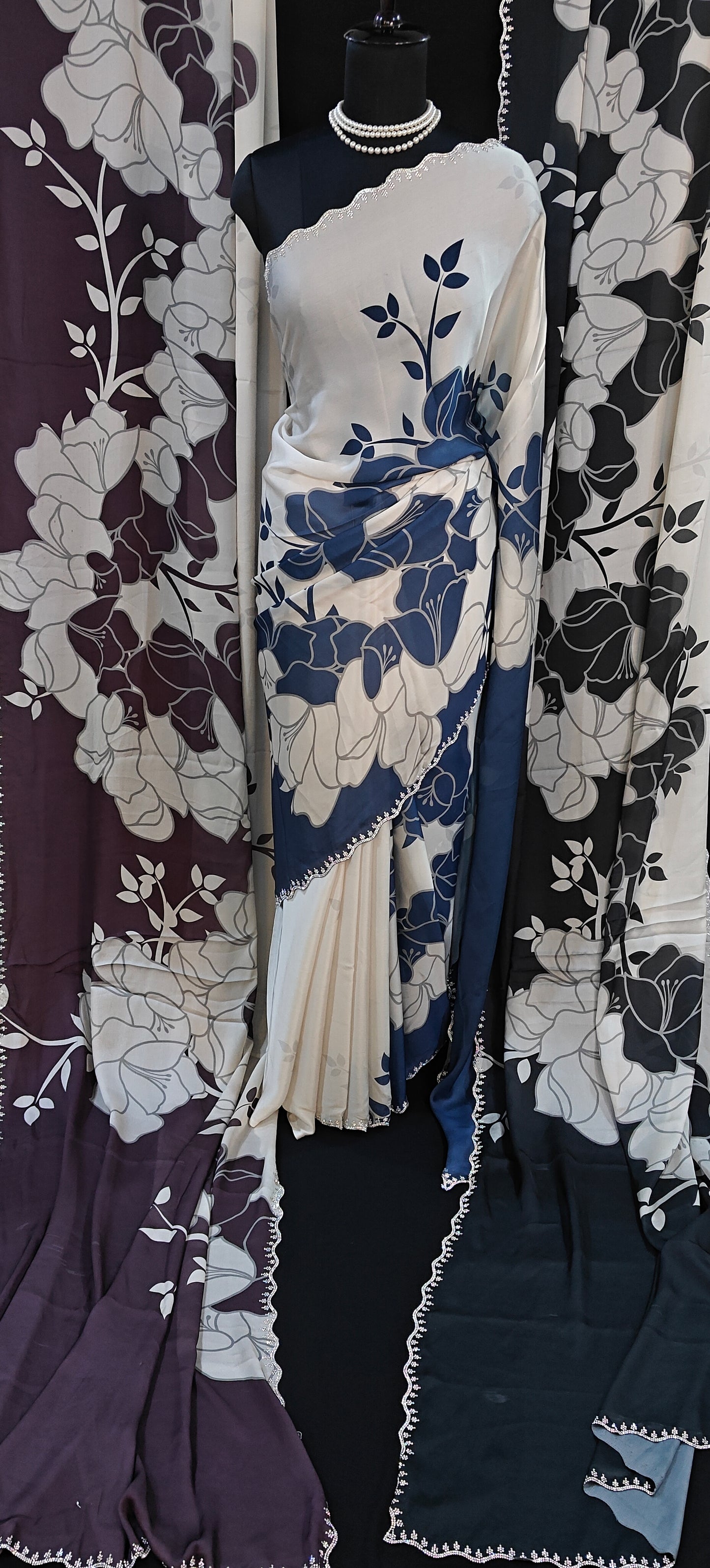 Satin Saree with Bold Floral Motifs & Scalloped Border – Available in Blue, Black, and Wine Red colors.