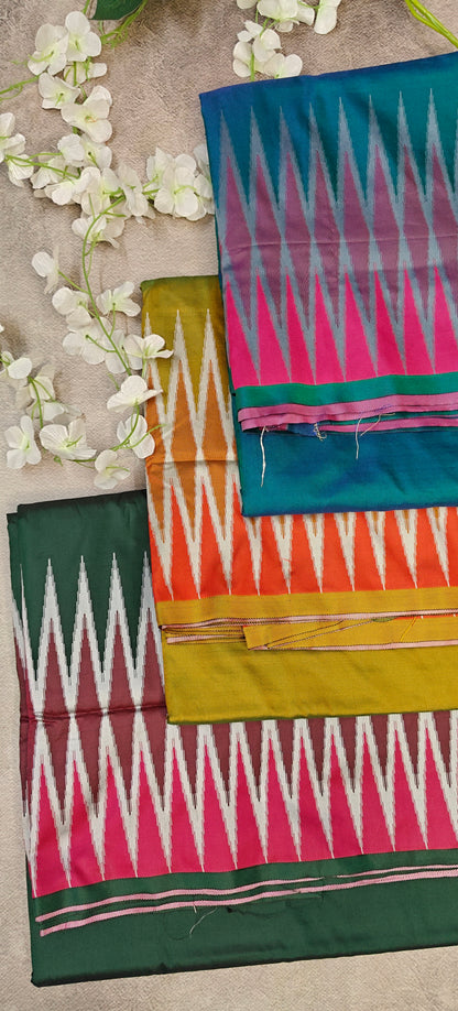 Peacock green, Mustard yellow, and Classic green viscose blended silk sarees lying folded and flat on a beige background with flowers.