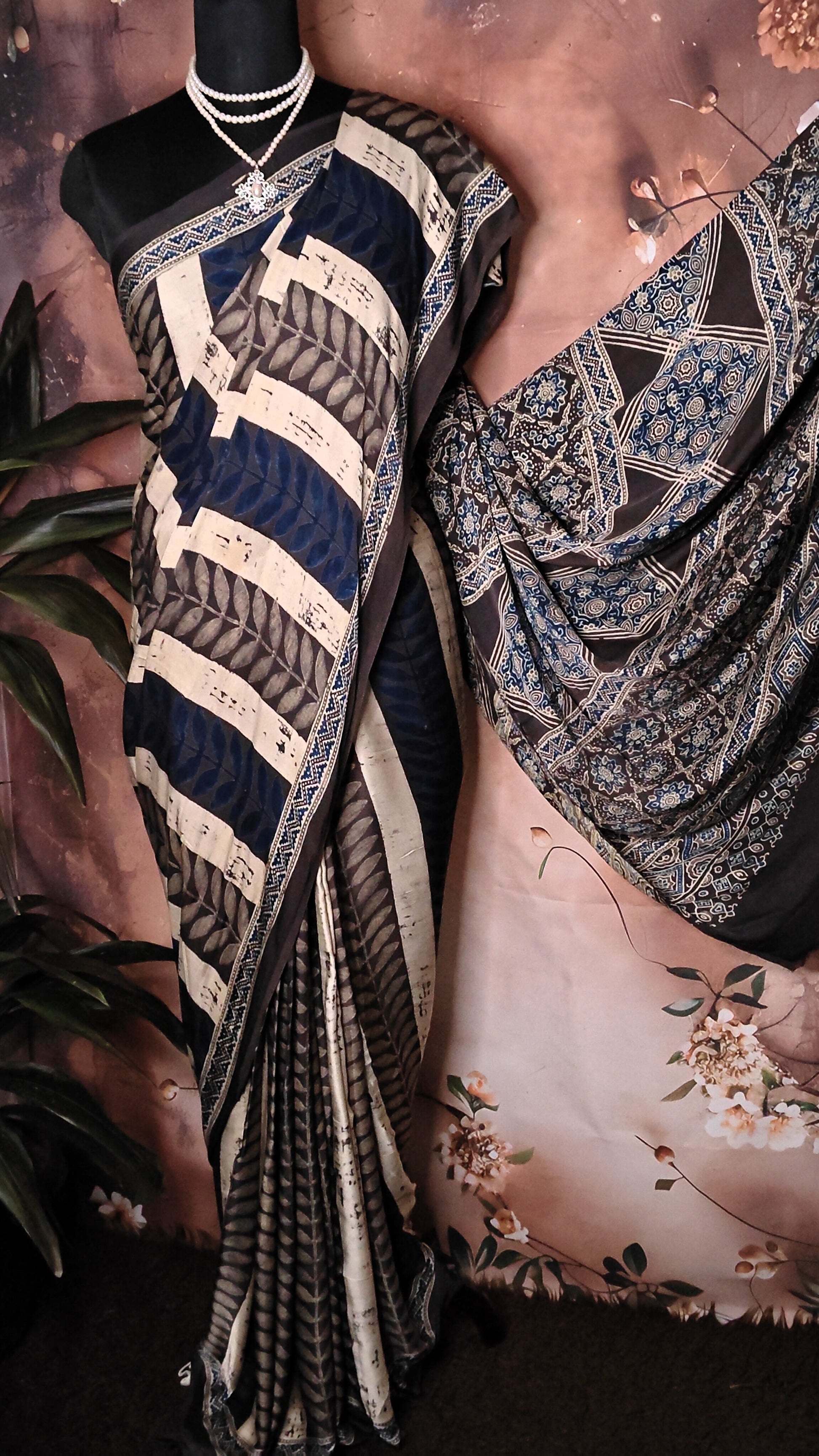 Ajrakh Modal Silk Saree – Dark Blue, Beige & Black with Geometric Floral Pallu saree with intricate patterns draped over a mannequin.