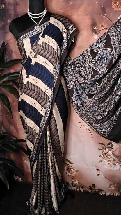 Ajrakh Modal Silk Saree – Dark Blue, Beige & Black with Geometric Floral Pallu saree with intricate patterns draped over a mannequin.