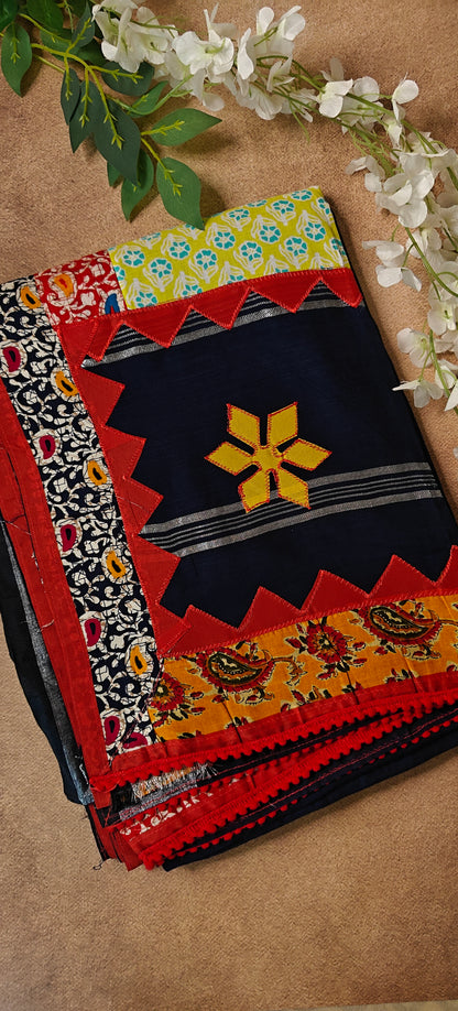 Navy blue cotton saree featuring vibrant appliqué panels and zigzag borders, artisan-made ethnic wear.