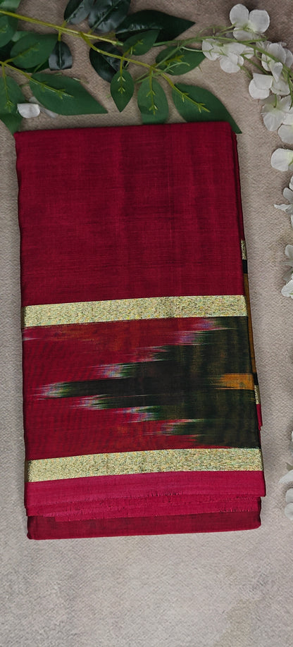 Wine cotton saree with abstract brushstroke border and golden trim, styled on mannequin with neutral background.