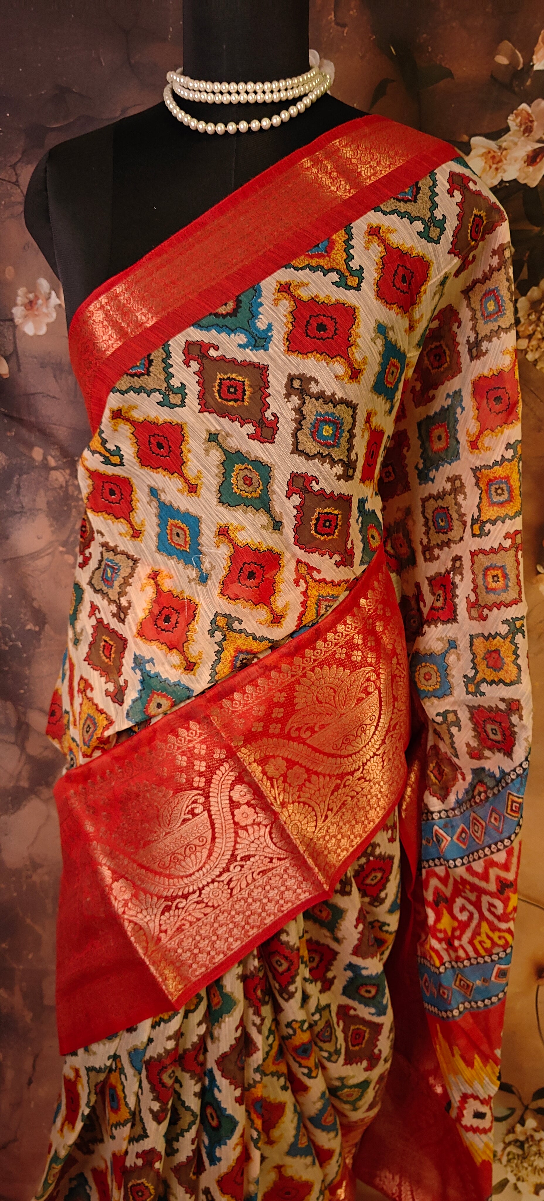 Designer Cotton Blend Saree – Patola Print with Zari Border saree draped on a mannequin.