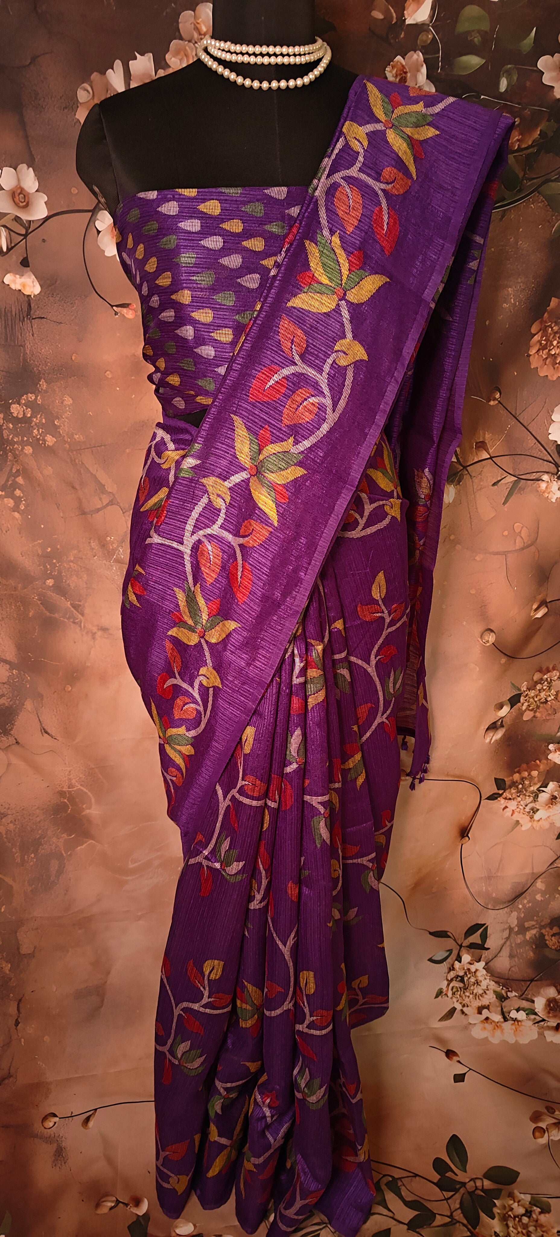 Designer Cotton Blend Saree – Purple with Multicolor Leaf & Vine Motifs saree draped on a mannequin.