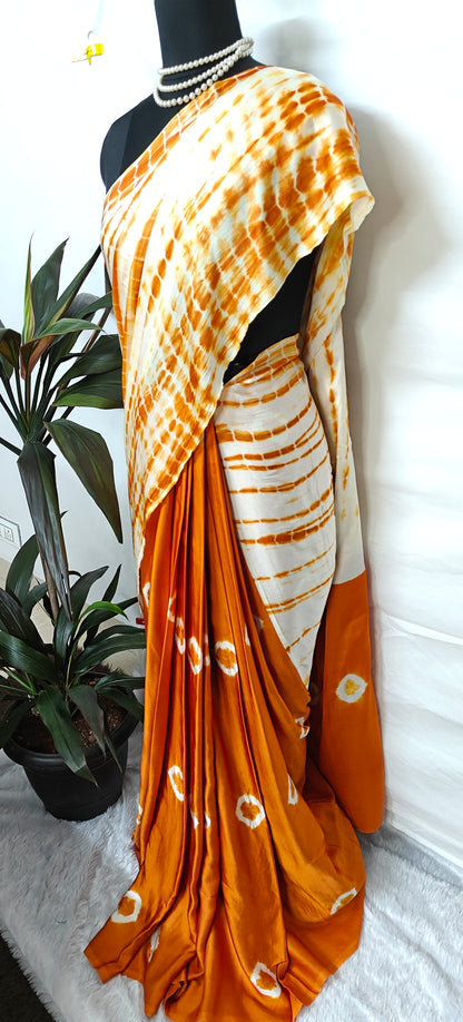 Designer Modal Silk Saree – Bandhani Print in Orange & White with Shibori Pallu on a mannequin.
