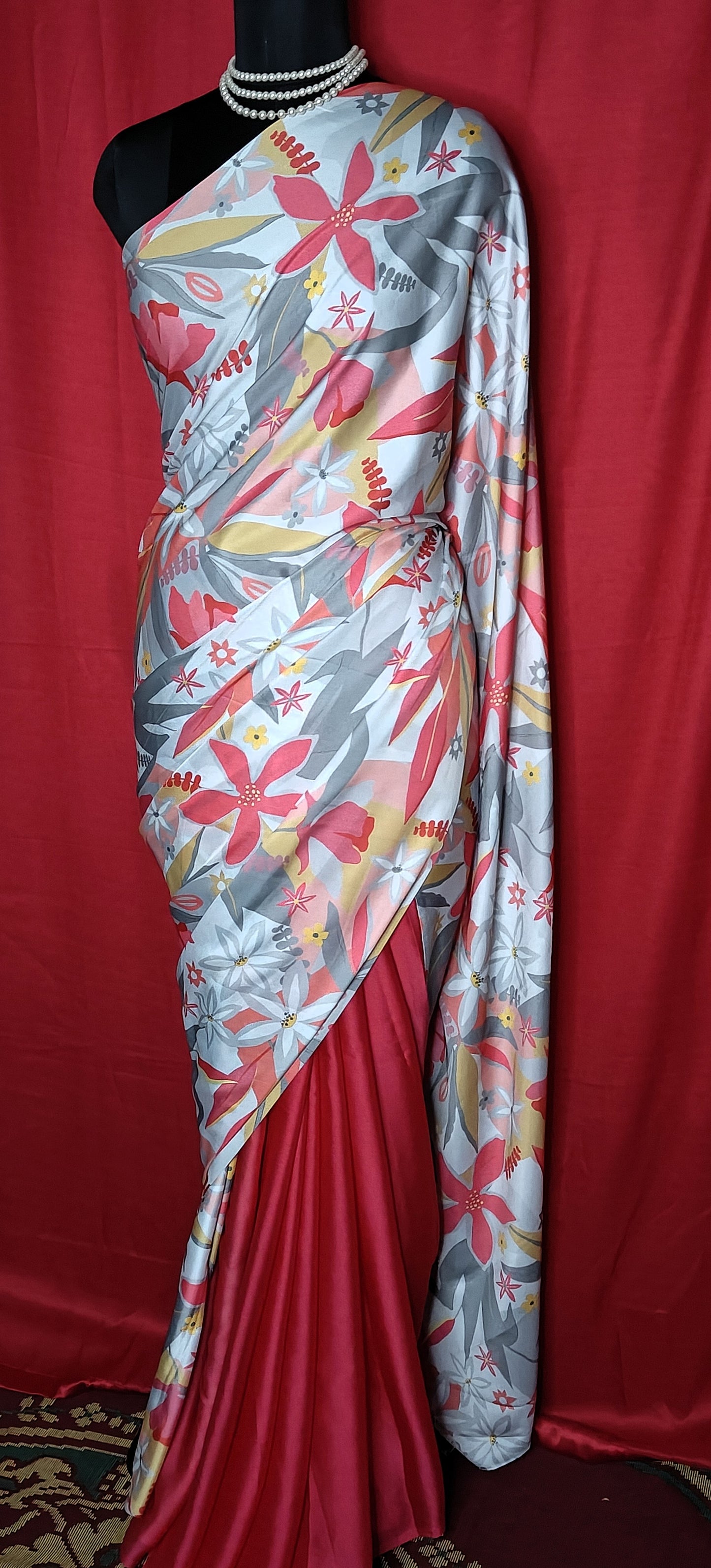 Designer Satin-Georgette Saree – Grey Base with Multicolor Floral Print draped on a mannequin.