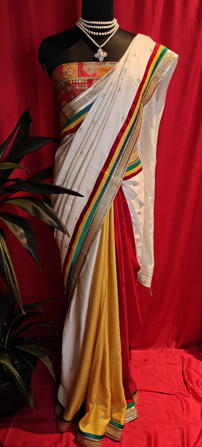 Designer Silk Saree with Brocade Blouse – Multicolor Elegance with Lace Border draped on a mannequin.