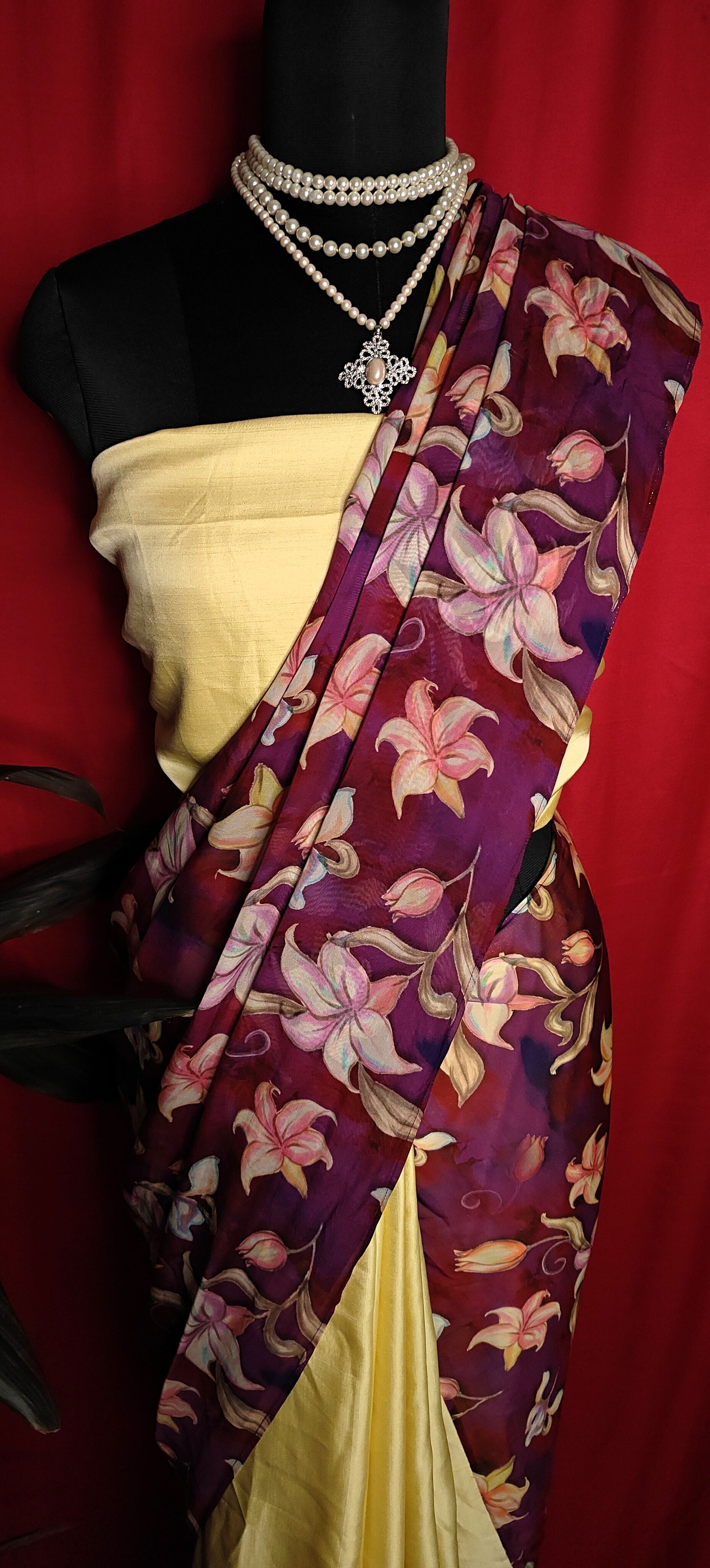 Designer Strawberry Silk Saree – Yellow & Purple with Floral Pure Organza Pallu draped on a mannequin.