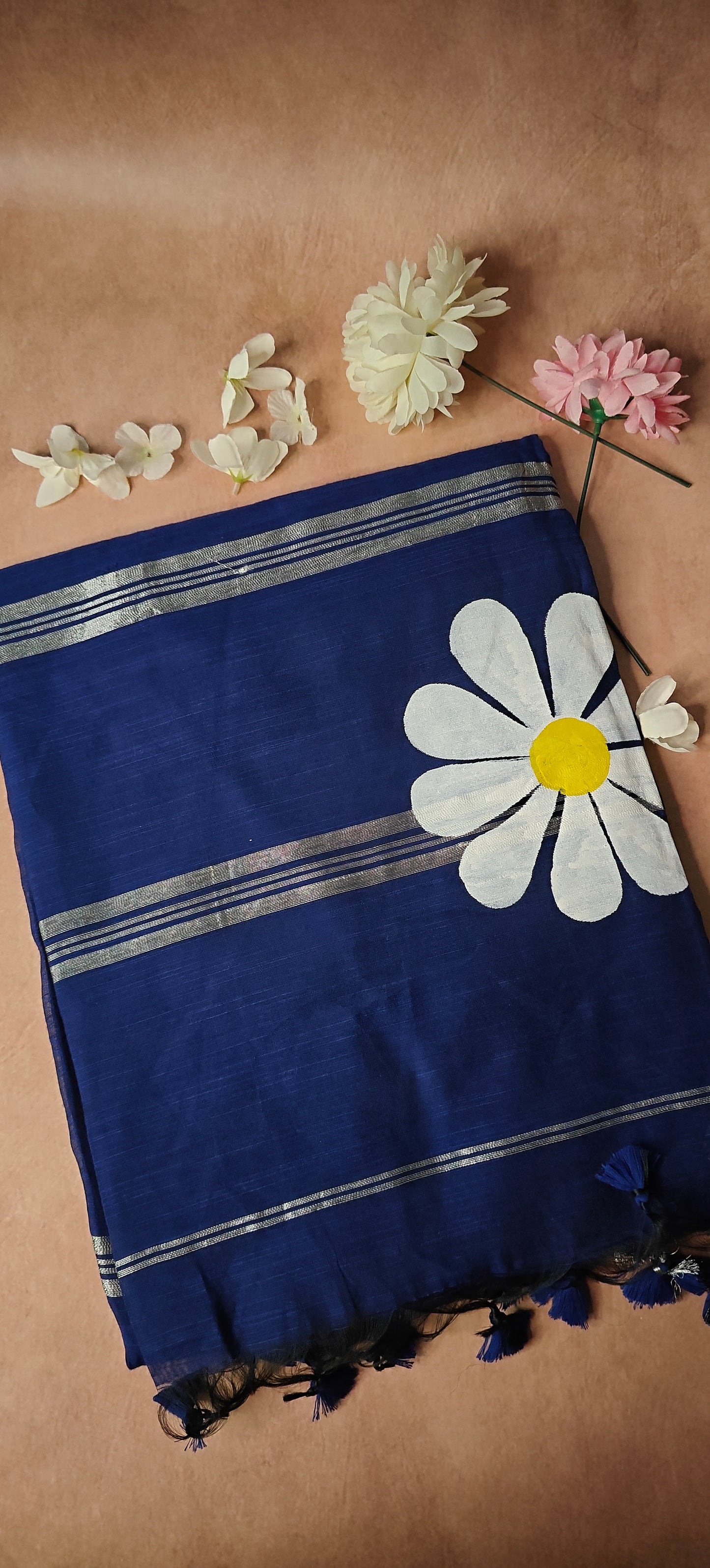 Navy cotton saree with hand-painted sunflower motifs and tassel border, breathable traditional Indian attire.