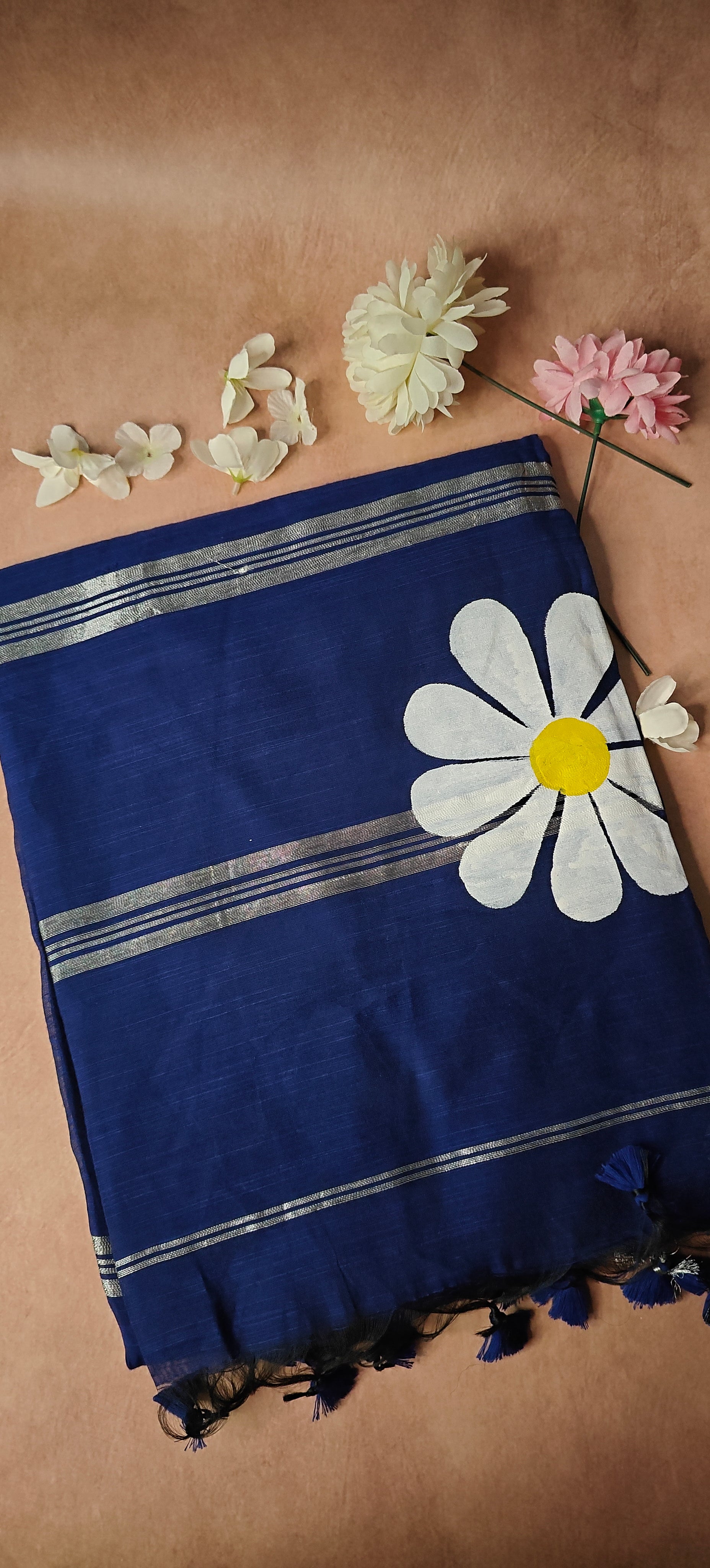 Navy cotton saree with hand-painted sunflower motifs and tassel border, breathable traditional Indian attire.