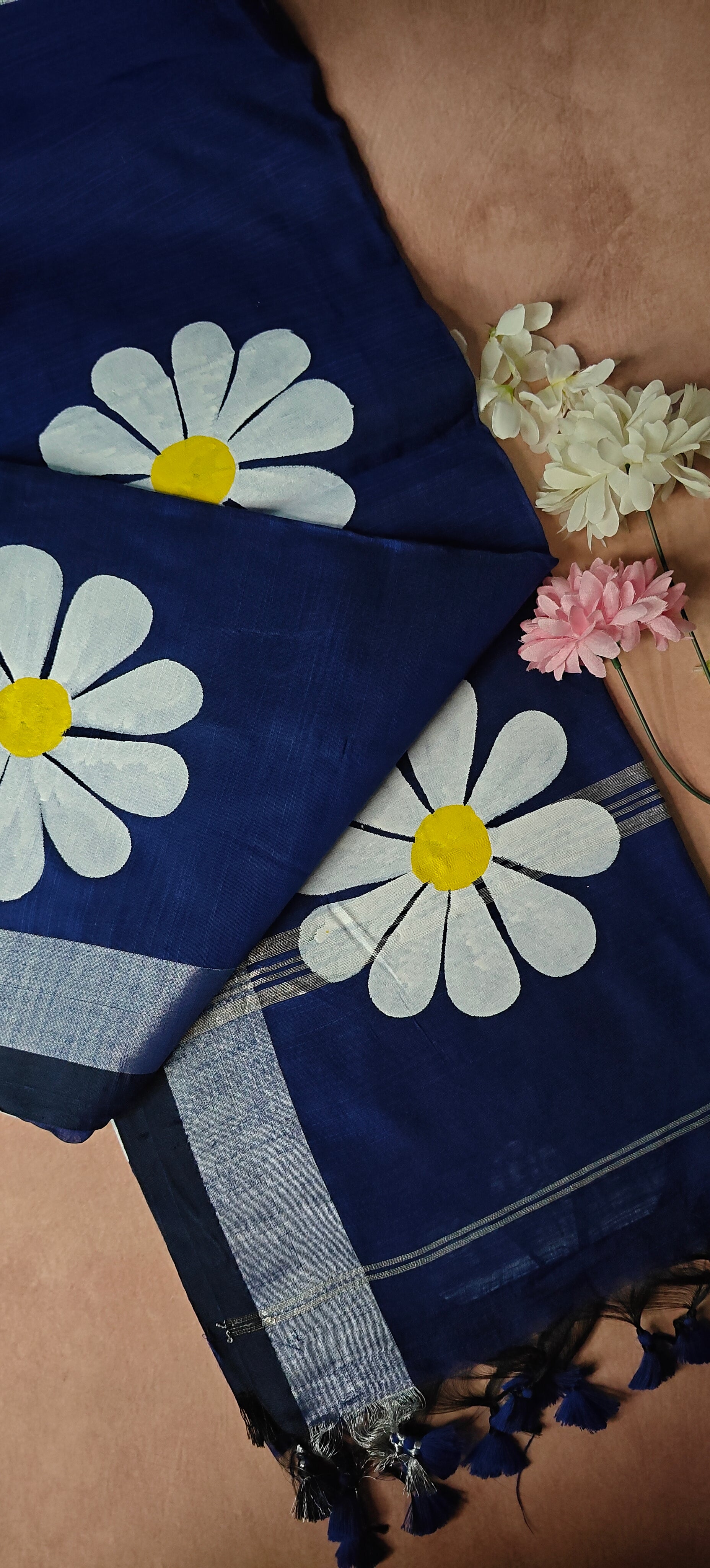 Navy cotton saree with hand-painted sunflower motifs and tassel border, breathable traditional Indian attire.