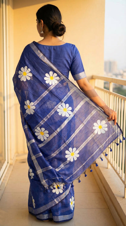 Woman wearing Navy cotton saree with hand-painted sunflower motifs and tassel border, breathable traditional Indian attire.