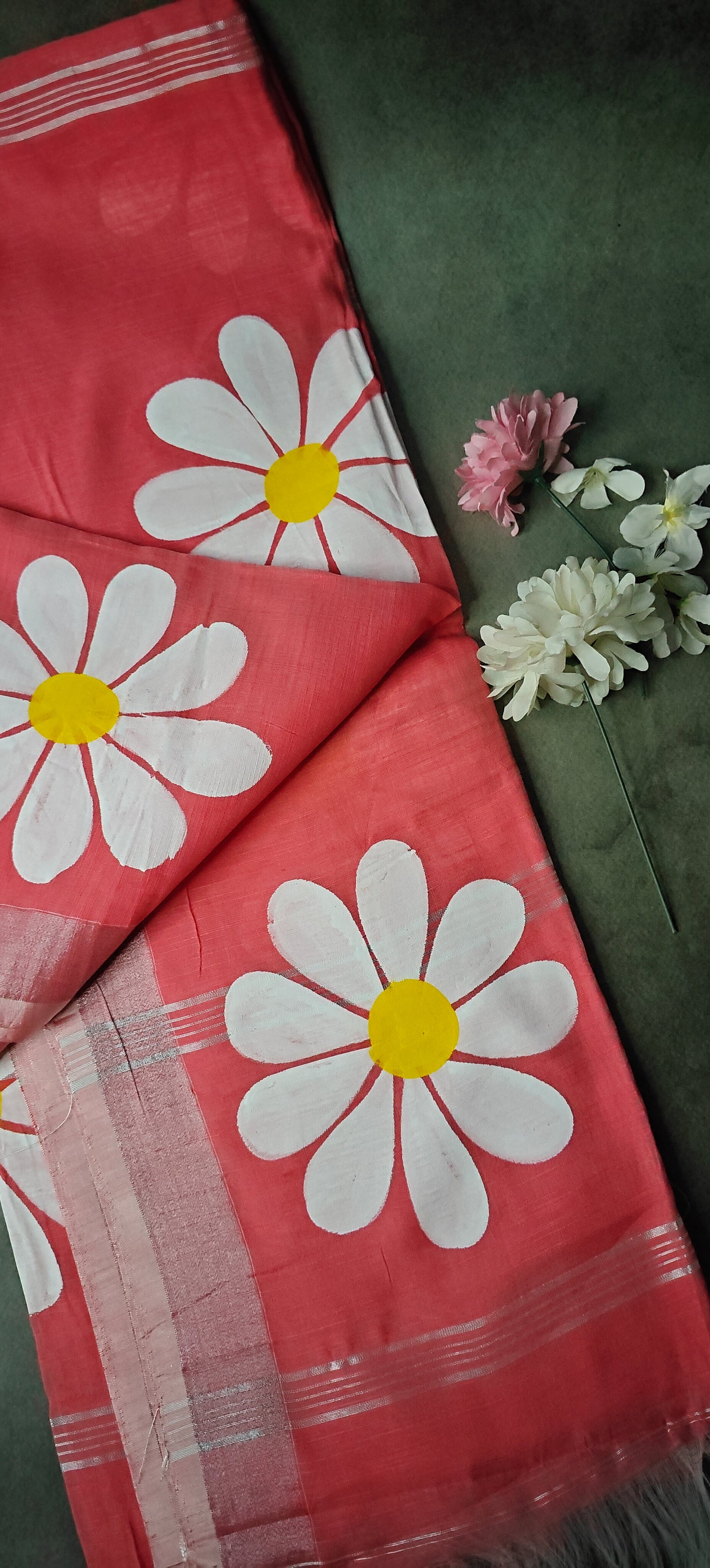 Pink cotton saree with hand-painted sunflower artwork and silver border, lightweight ethnic fashion.