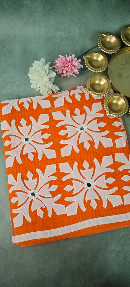 Orange Kota saree with symmetrical white floral appliqué and soft texture, handcrafted traditional Indian saree.
