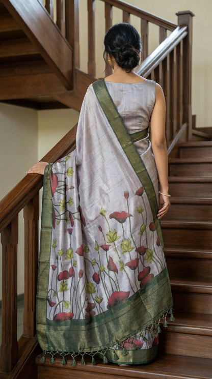 Woman in a light-pink-viscose-silk-floral-saree, walking up a wooden staircase.