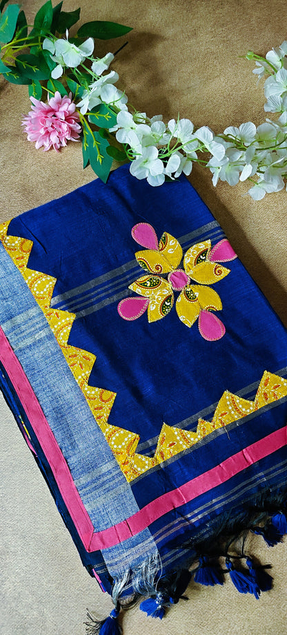 Navy linen cotton saree with multicolor floral appliqué and hand embroidery, artisan-crafted traditional Indian saree.