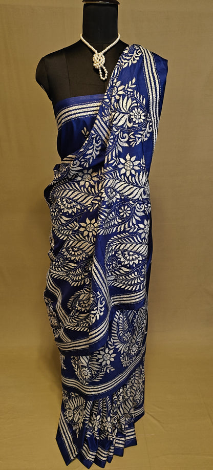 Luxury Kantha-Stitched Silk Saree – Deep Blue with White Paisley & Floral Bands saree on a mannequin with neutral background.