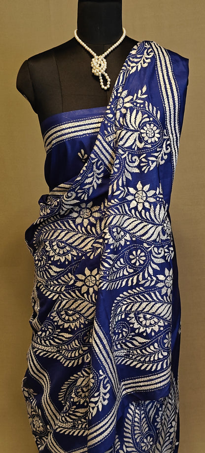 Luxury Kantha-Stitched Silk Saree – Deep Blue with White Paisley & Floral Bands saree on a mannequin with neutral background.