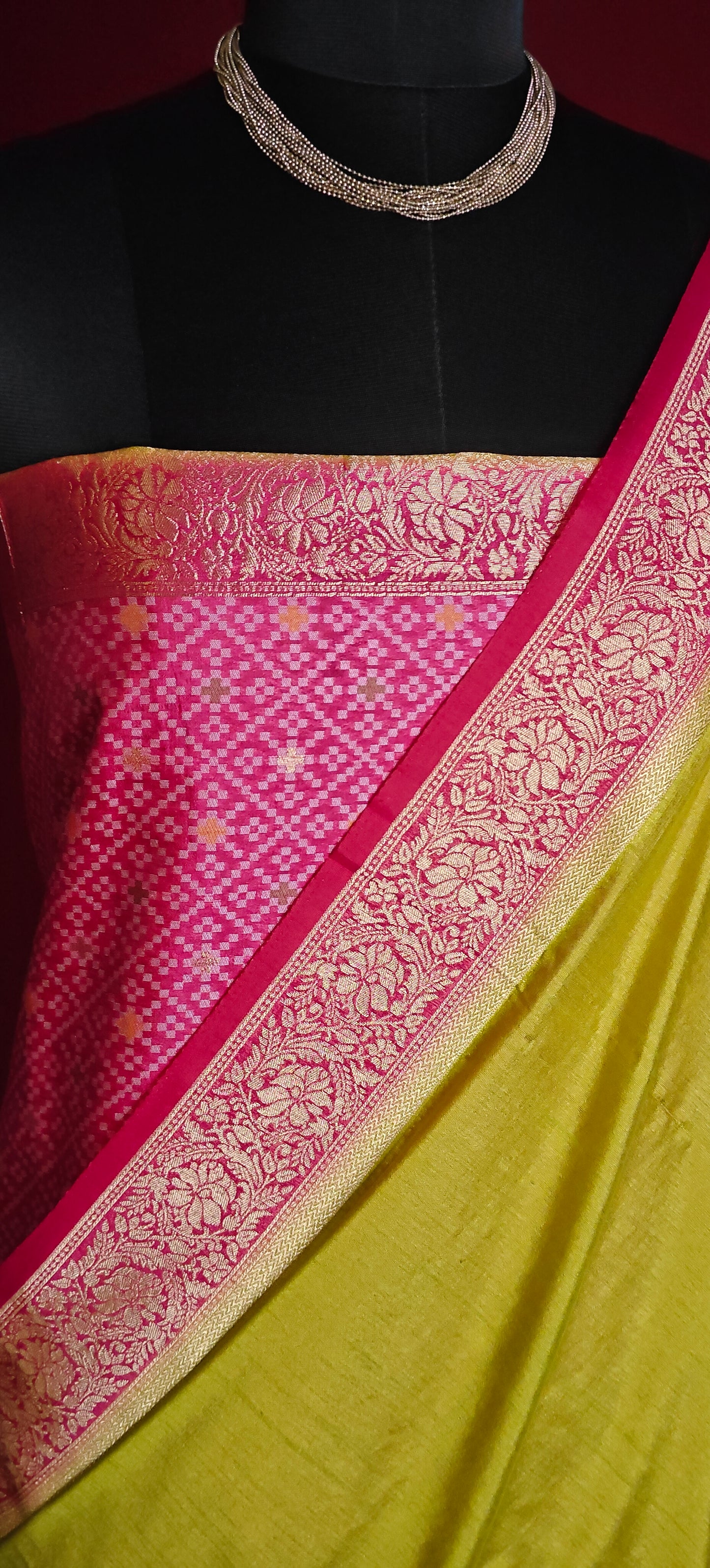 Green Pochampally silk saree with traditional ikat weave and shimmering zari border.