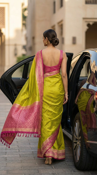Woman in a Green Pochampally silk saree with traditional ikat weave and shimmering Zari border, standing next to a luxury car.