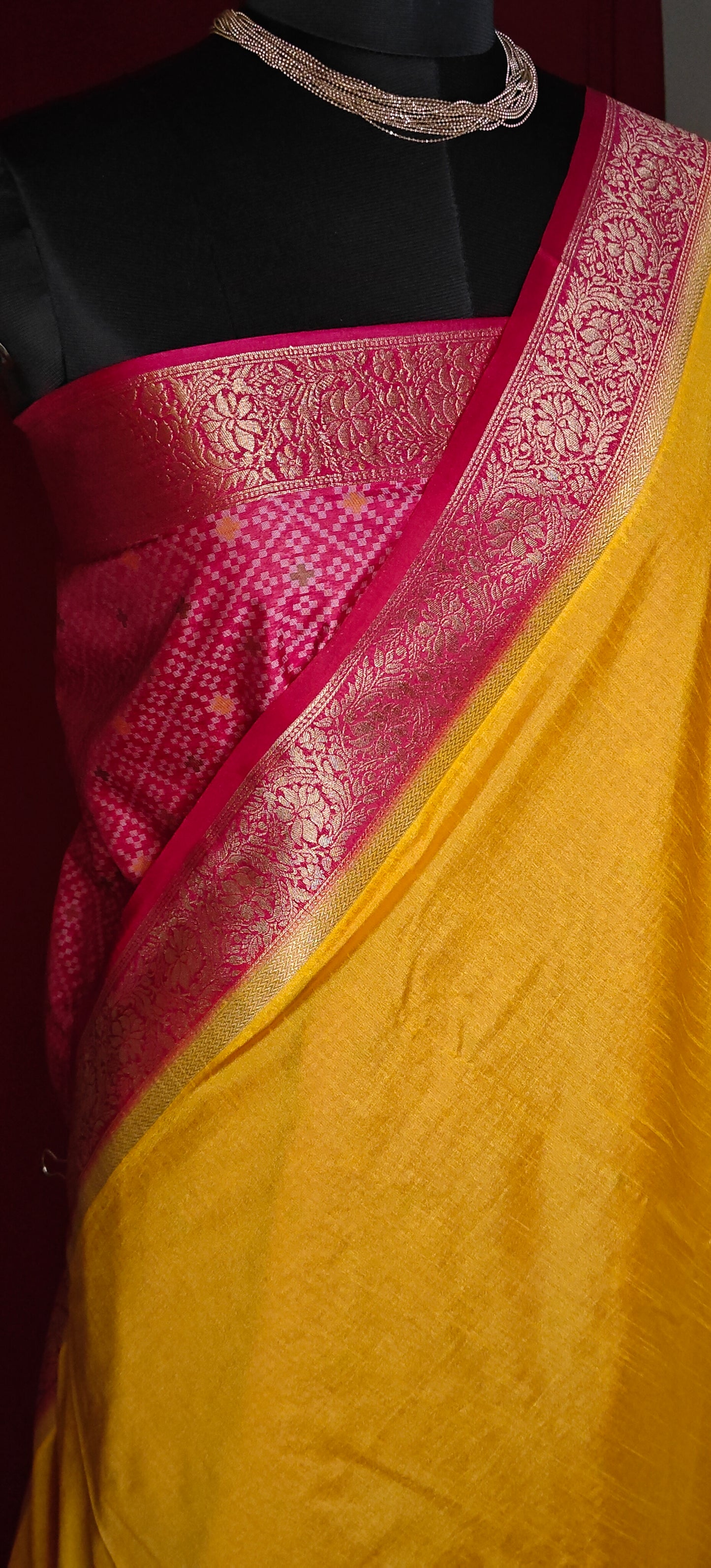 Bright yellow Pochampally silk saree with geometric ikat patterns and rich gold zari border.