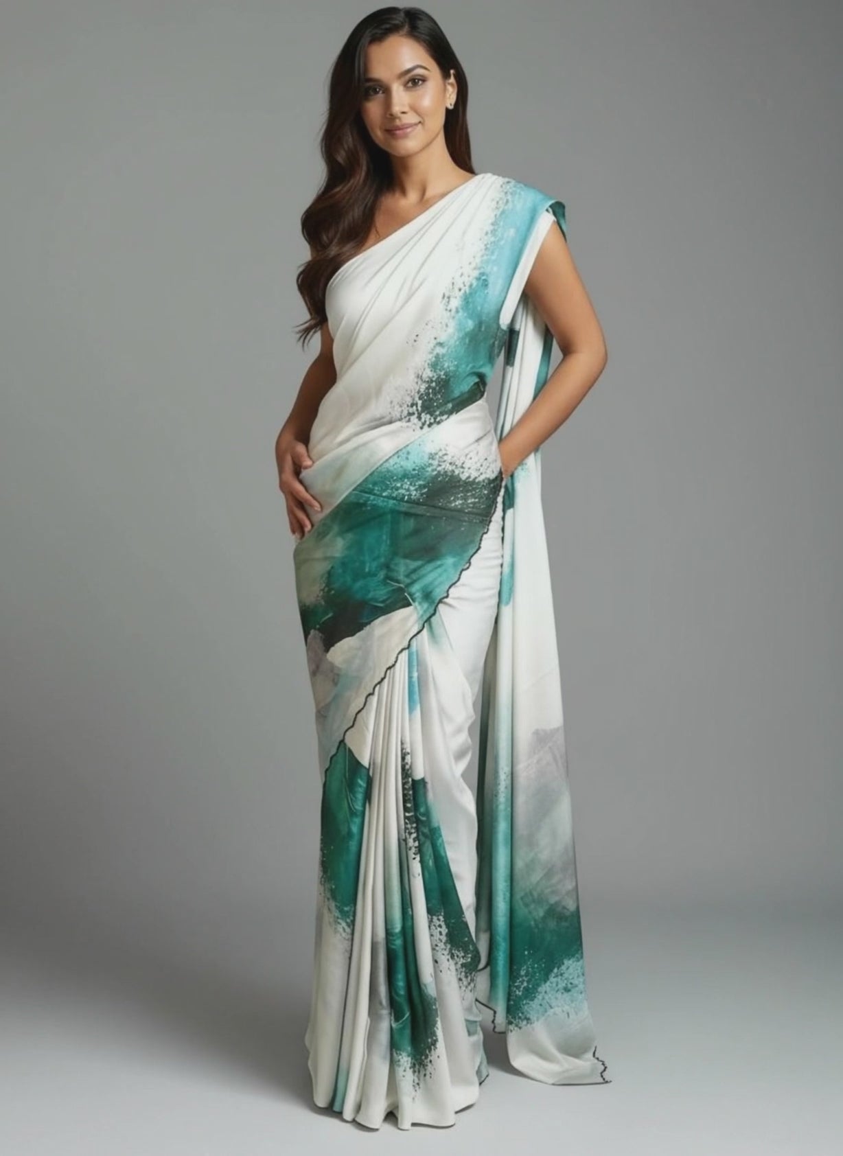 Lady wearing green satin-georgette saree with expressive brushstroke motifs and scalloped border, modern ethnic saree for cultural occasions against grey background.