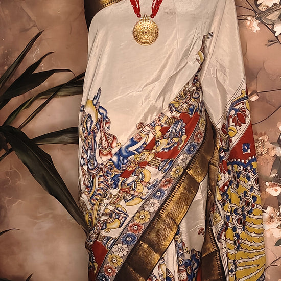 Handcrafted Mangalgiri Border Silk Saree with Temple Art Motifs-Cream color saree with intricate patterns on a mannequin against a neutral background.