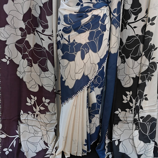 Satin Saree with Bold Floral Motifs & Scalloped Border – Available in Blue, Black, and Wine Red colors.