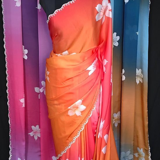 Satin Saree with Gradient Floral Design – Available in Red-Orange, Pink-Purple, and Blue-Brown. Red-Orange saree is put on mannequin and the other two are hanged as the backdrop.