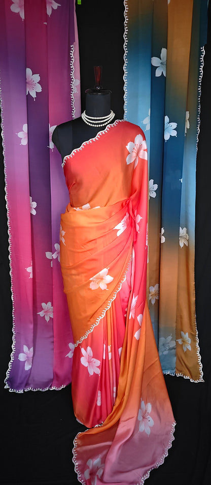 Satin Saree with Gradient Floral Design – Available in Red-Orange, Pink-Purple, and Blue-Brown. Red-Orange saree is put on mannequin and the other two are hanged as the backdrop.