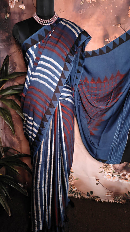 Ajrakh Modal Silk Saree – Deep Blue with Maroon Chevron & Triangular Border Motifs saree draped over a mannequin.