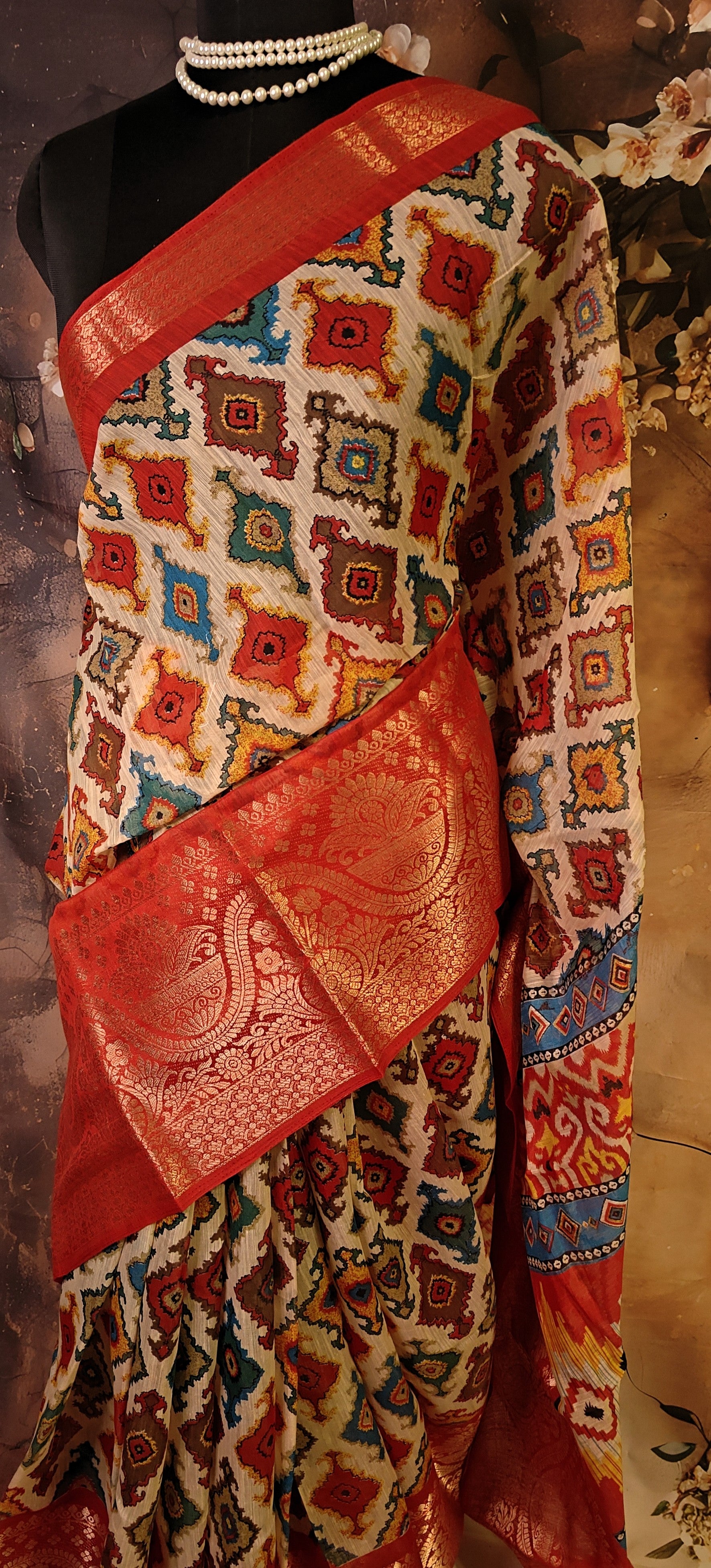 Designer Cotton Blend Saree – Patola Print with Zari Border saree draped on a mannequin.