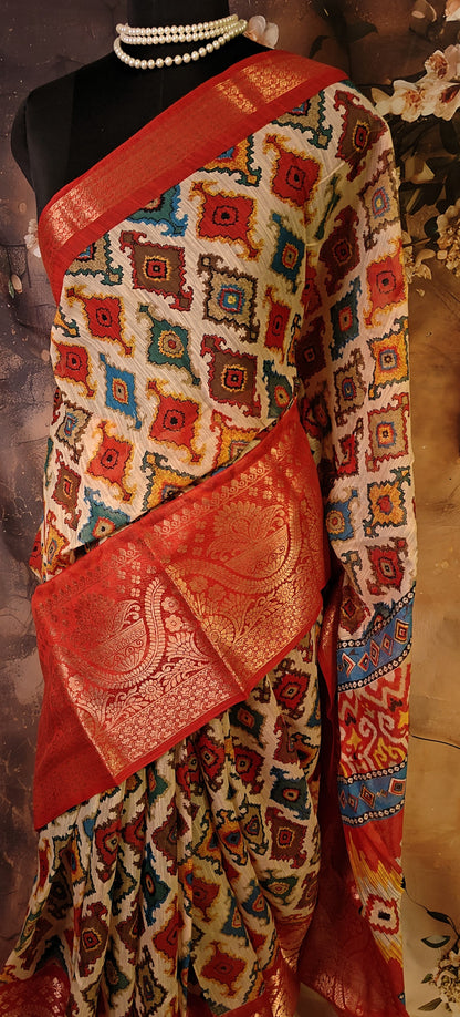 Designer Cotton Blend Saree – Patola Print with Zari Border saree draped on a mannequin.