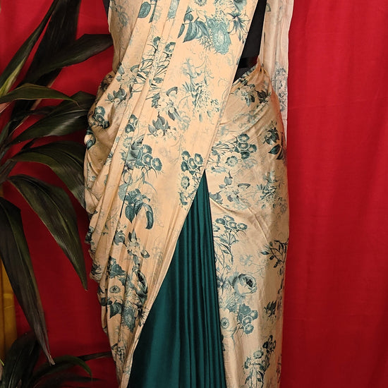 Designer Modal Silk Saree – Beige & Deep Green with Floral Print and Dual-Tone Drape saree draped on a mannequin.