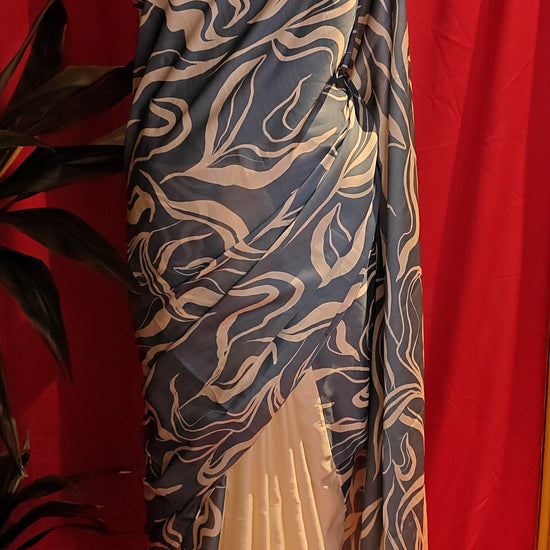 Designer Silk Saree – Blue Abstract Print with Cream Pallu saree draped on a mannequin.