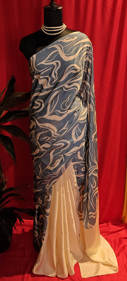 Designer Silk Saree – Blue Abstract Print with Cream Pallu saree draped on a mannequin.