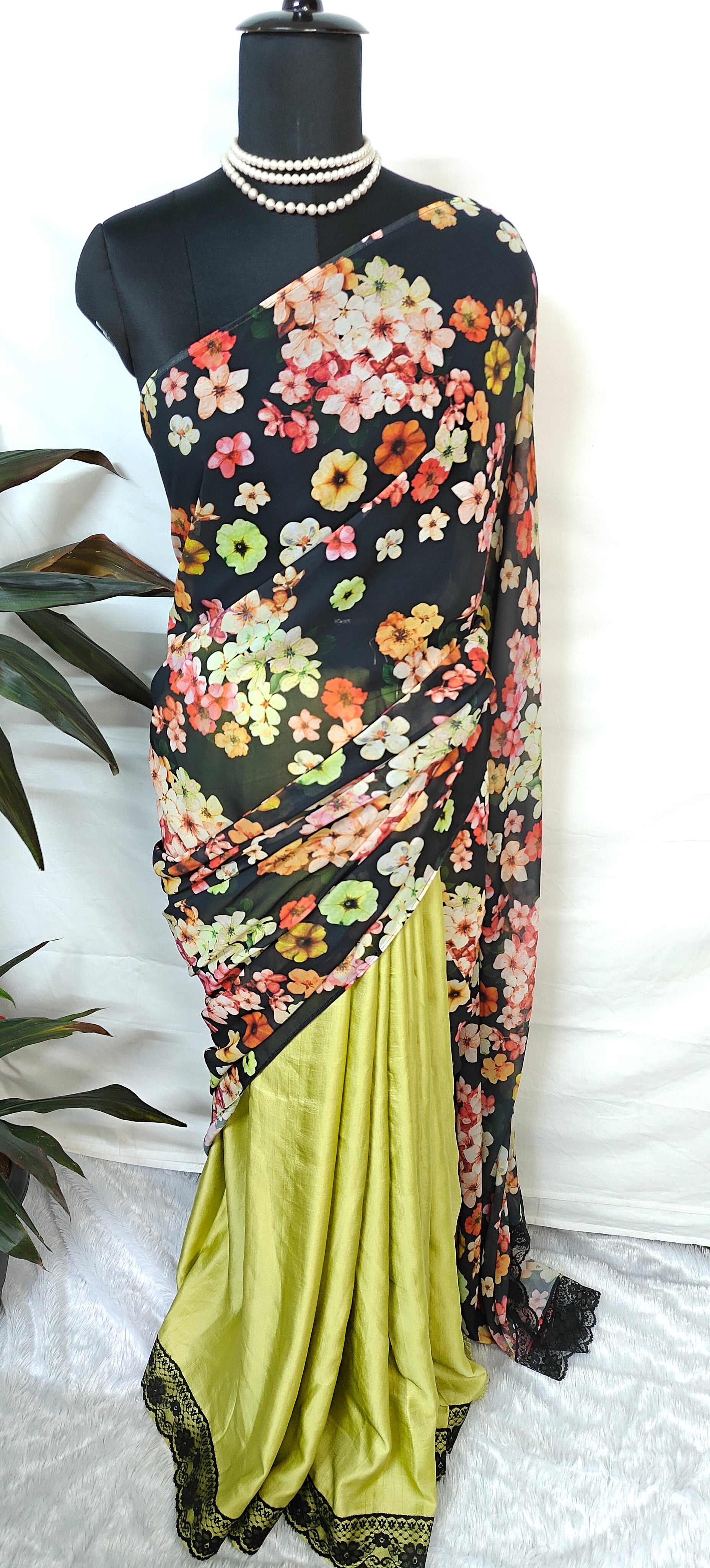 Designer Silk Saree with Printed Organza Pallu – Black & Mint Green Floral Elegance draped on a mannequin.