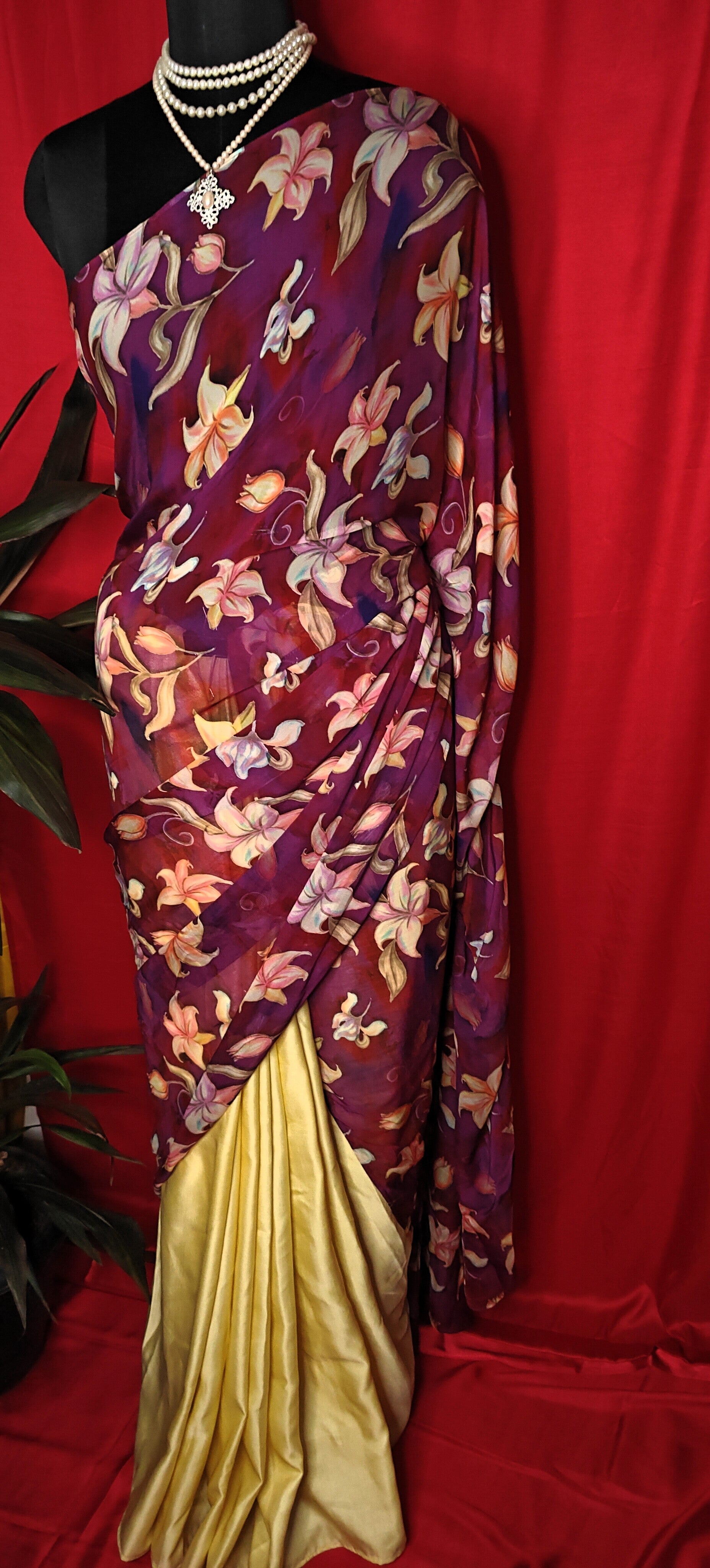 Designer Strawberry Silk Saree – Yellow & Purple with Floral Pure Organza Pallu draped on a mannequin.