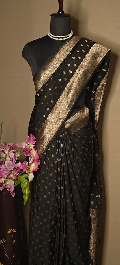 Black blended silk saree with silver Khaddi Butti motifs and rich border, displayed on mannequin.