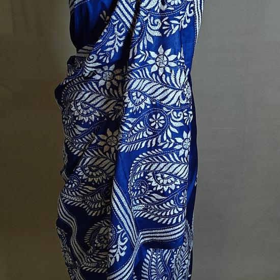 Luxury Kantha-Stitched Silk Saree – Deep Blue with White Paisley & Floral Bands saree on a mannequin with neutral background.