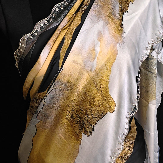 Yellow satin saree with abstract print and scalloped silver border