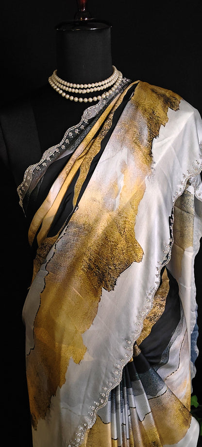 Yellow satin saree with abstract print and scalloped silver border